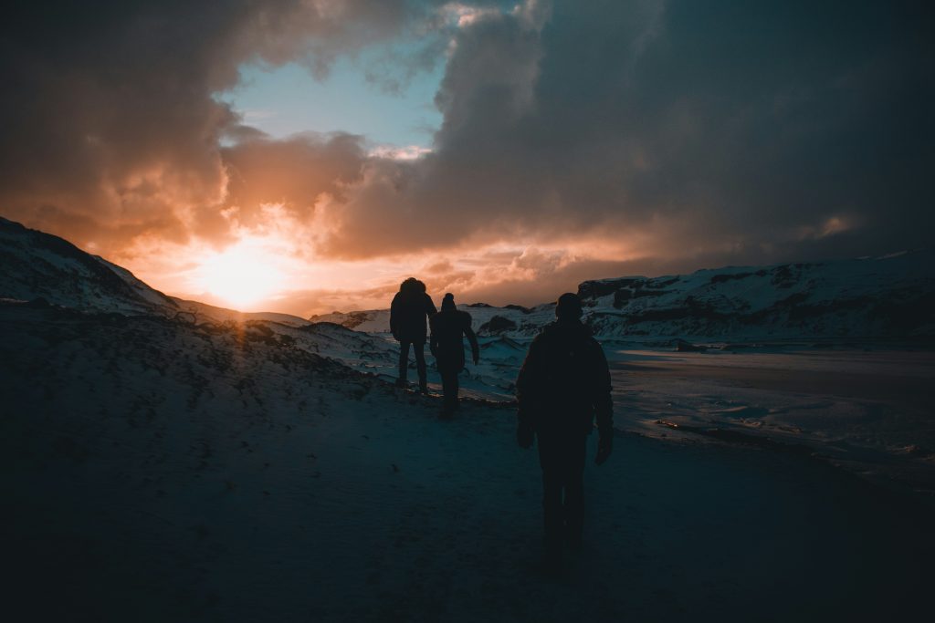 Midnight sun casting golden light over Icelandic mountains